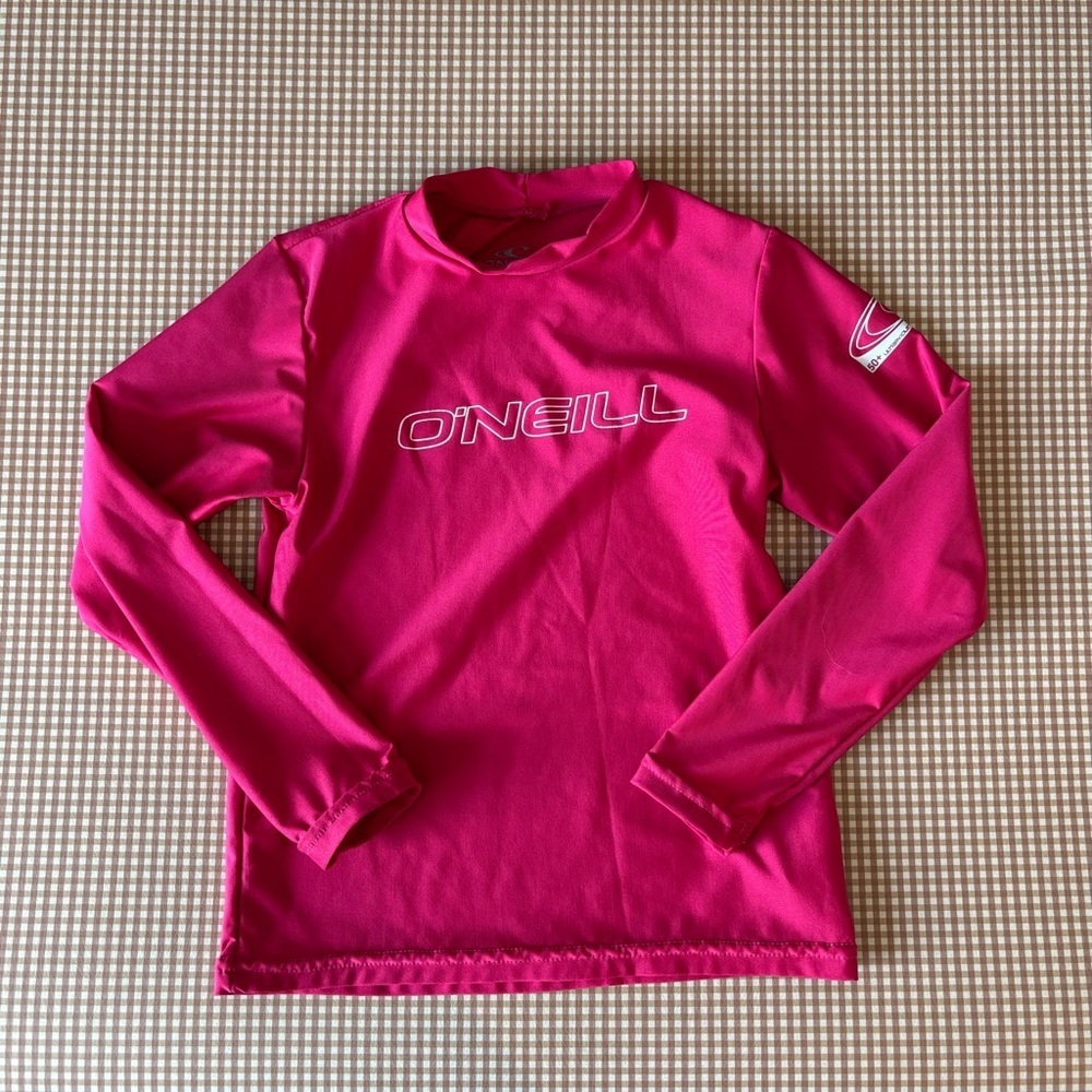 O’NEILL Rashguard long sleeve swim top.Pink. 50+ UV protection. Size 6